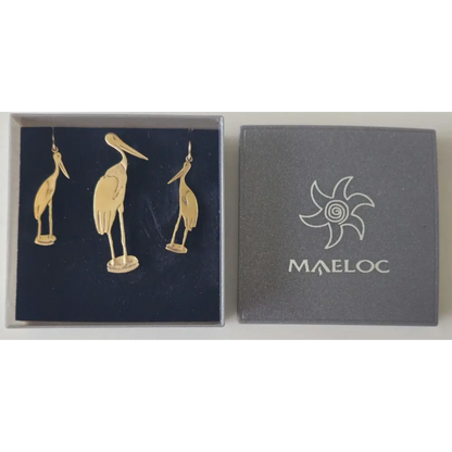 Jewelry box with gold bird-shaped earrings and Maeloc logo