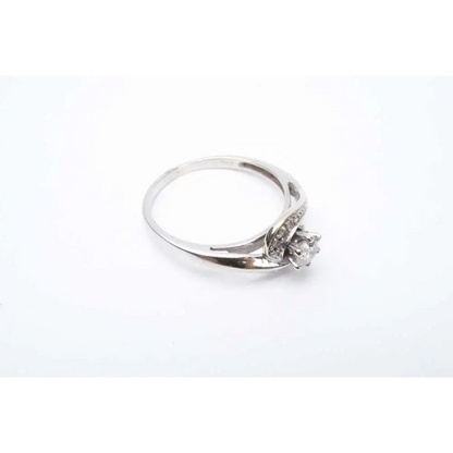 Silver ring with a diamond on a white background