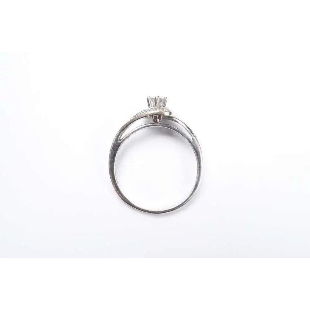 Silver ring with a diamond on a white background