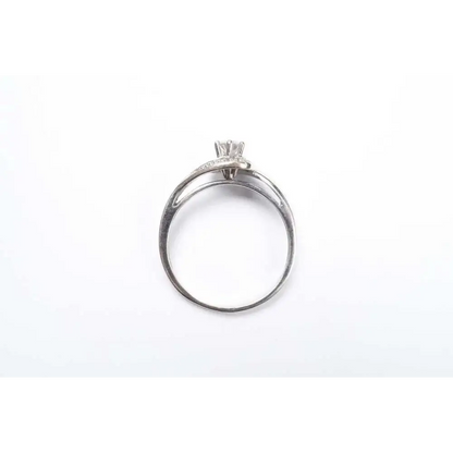 Silver ring with a diamond on a white background