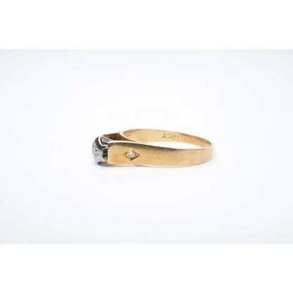 Gold ring with a diamond on a white background