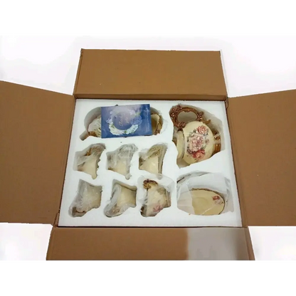 Open cardboard box containing decorative items