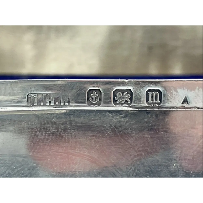 Close-up of a silver object with engraved marks 