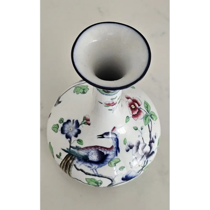 Close-up of the vibrant floral details and rich colors on the English Coronaware Bird of Paradise vase.