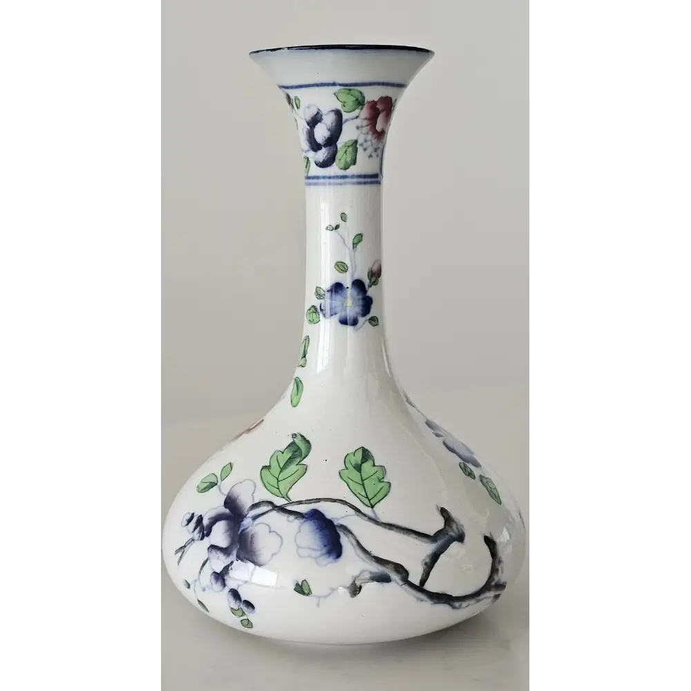 White vase with blue floral patterns on a gray background
