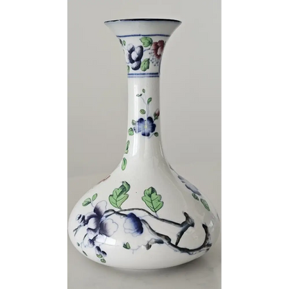 White vase with blue floral patterns on a gray background