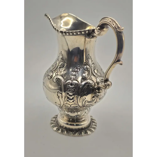 Decorative silver pitcher