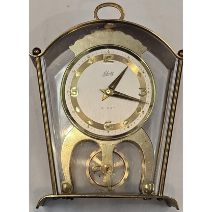 Vintage clock with gold and clear design