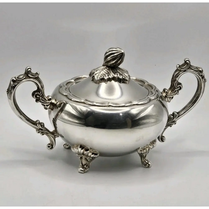 Silver sugar bowl with ornate handles