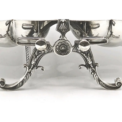 Silver decorative item with intricate designs 