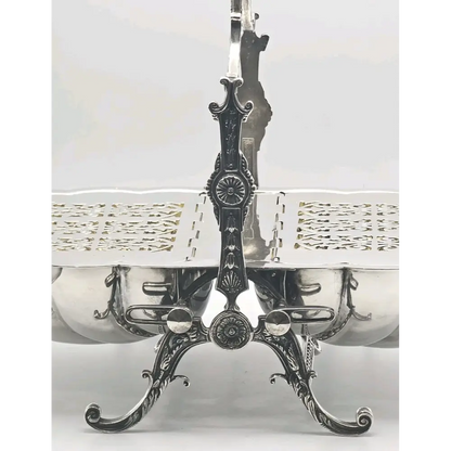 Decorative silver platter with intricate design on a white background