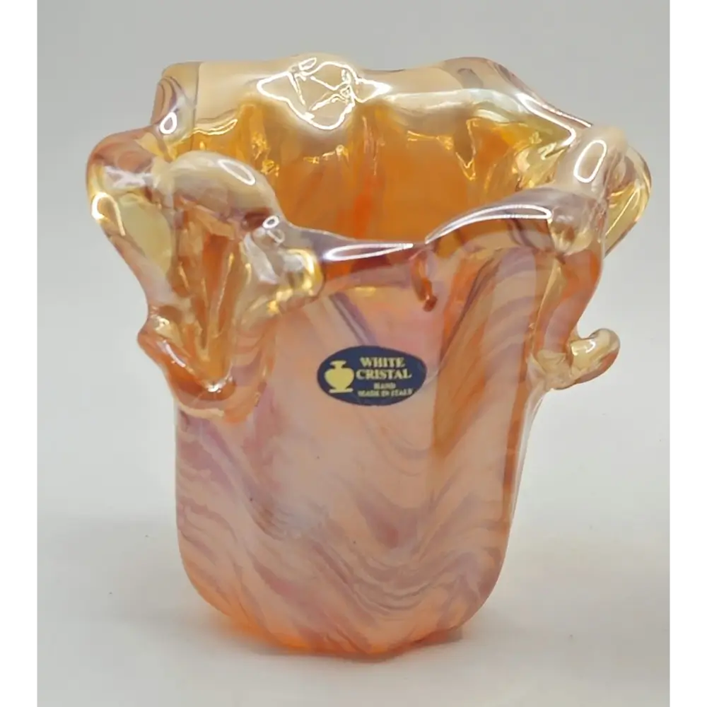 Side view of white Cristal Murano vase with orange swirl design
