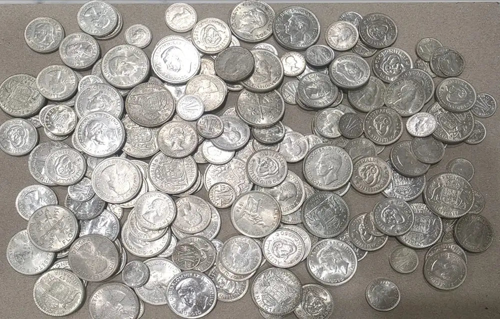 A large pile of silver-colored coins from our World & Vintage Coins, Gold Proof Sets & Commemorative Medals collection 