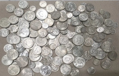 A large pile of silver-colored coins from our World & Vintage Coins, Gold Proof Sets & Commemorative Medals collection 