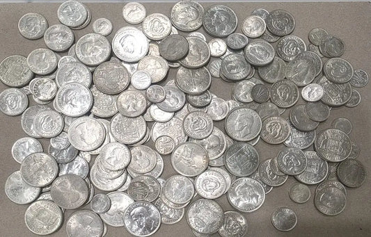 A large pile of silver-colored coins from our World & Vintage Coins, Gold Proof Sets & Commemorative Medals collection 