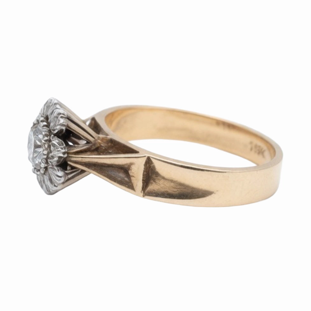 Gold ring with diamond on a white background
