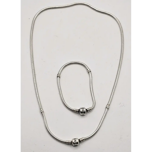 Silver necklace with a clasp on a white background