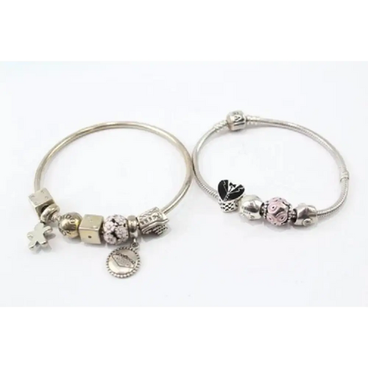 Two silver bracelets with charms