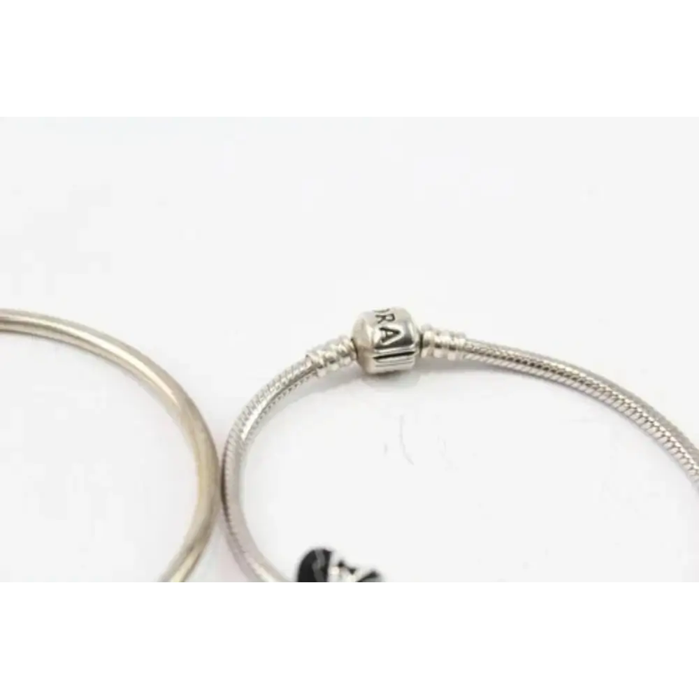 Silver bracelet with a clasp on a white background