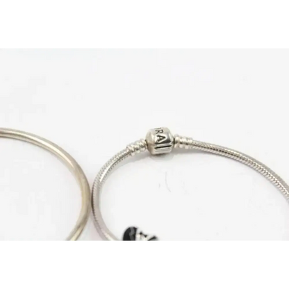 Silver bracelet with a clasp on a white background