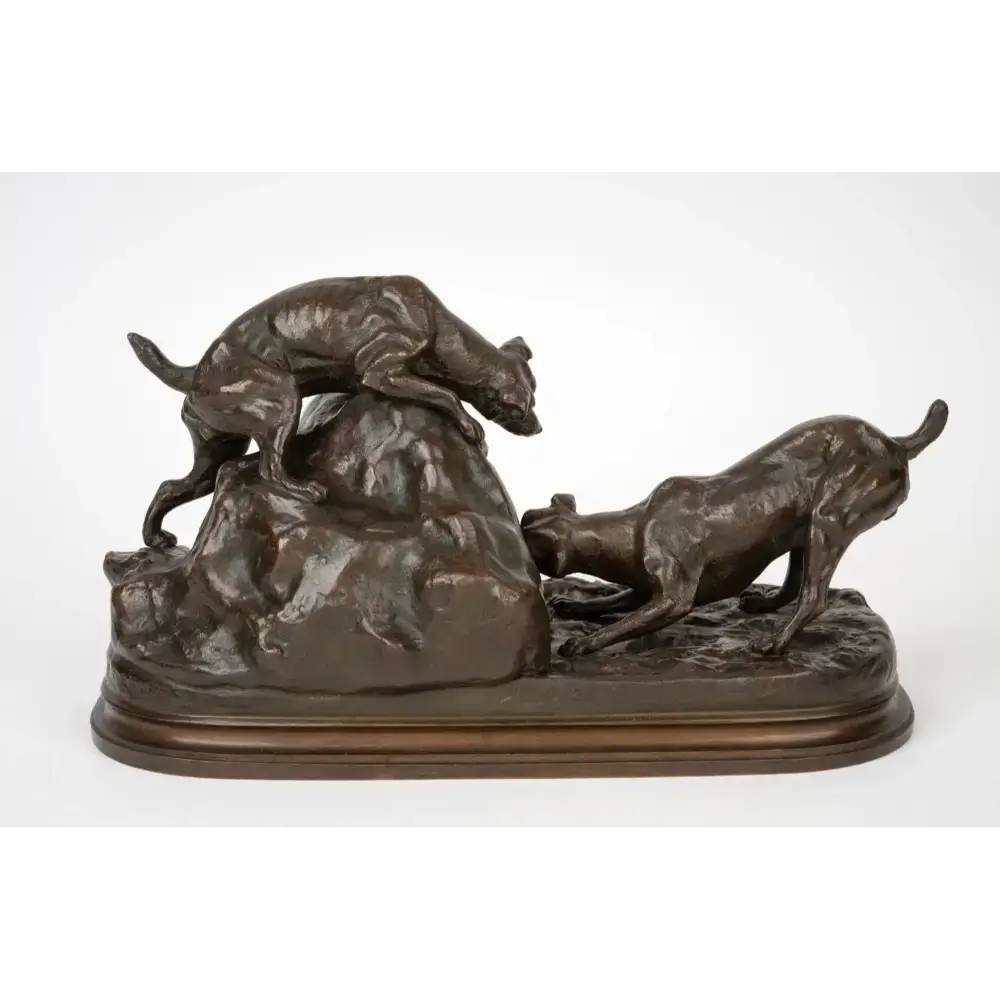 Bronze sculpture of two dogs chasing a boar on a white background