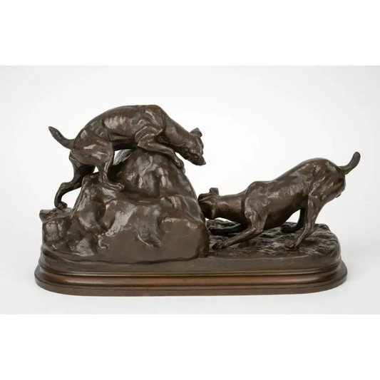 Bronze sculpture of two dogs chasing a boar on a white background
