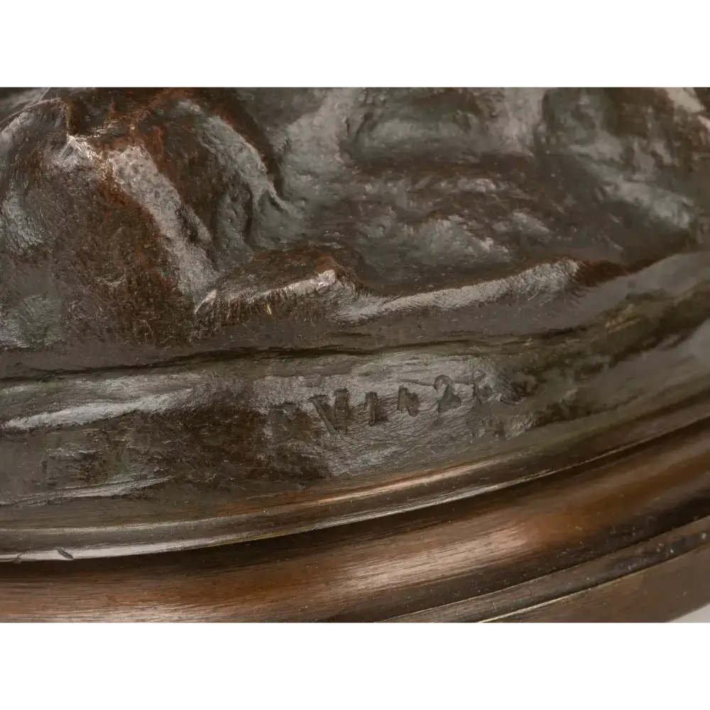 Close-up of a bronze sculpture with engraved details