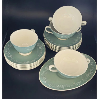 Ceramic tea set with green and white cups and saucers