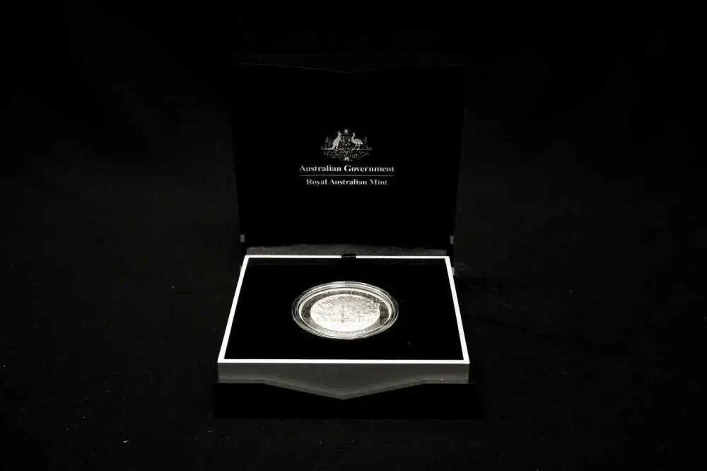 An Australian Government Silver Australia Mint coin presented in an open black display case against a black background.
