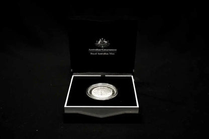 An Australian Government Silver Australia Mint coin presented in an open black display case against a black background.
