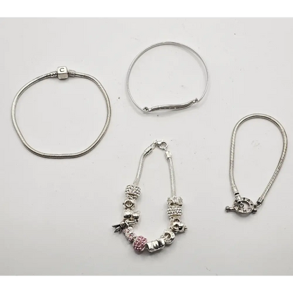 Set of silver bracelets with various charms