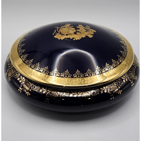 Decorative black dish with gold embellishments 