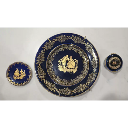 Set of blue ceramic plates with gold decorative elements