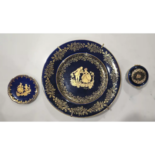 Set of blue ceramic plates with gold decorative elements