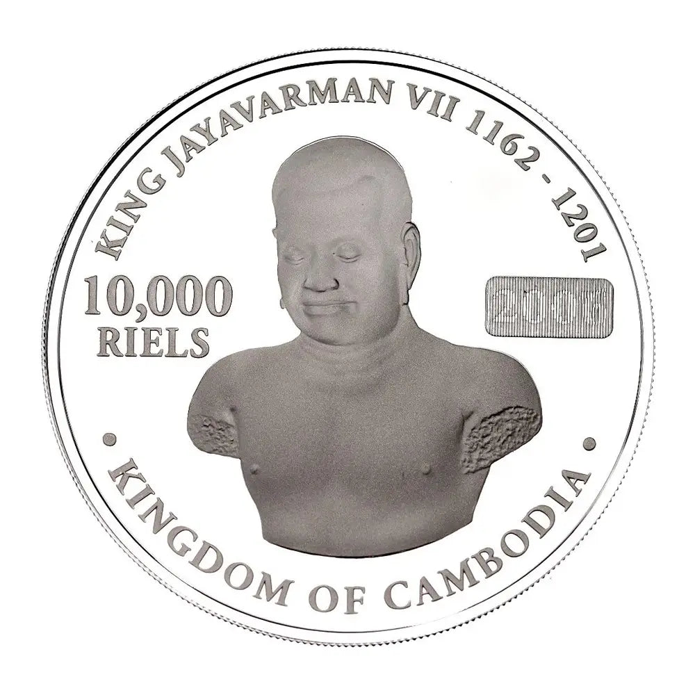 A circular silver coin featuring a relief bust of King Jayavarman VII of Cambodia, with the text 'KING JAYAVARMAN VII 1162 - 1201', '10,000 RIELS', and 'KINGDOM OF CAMBODIA' on a plain white background.