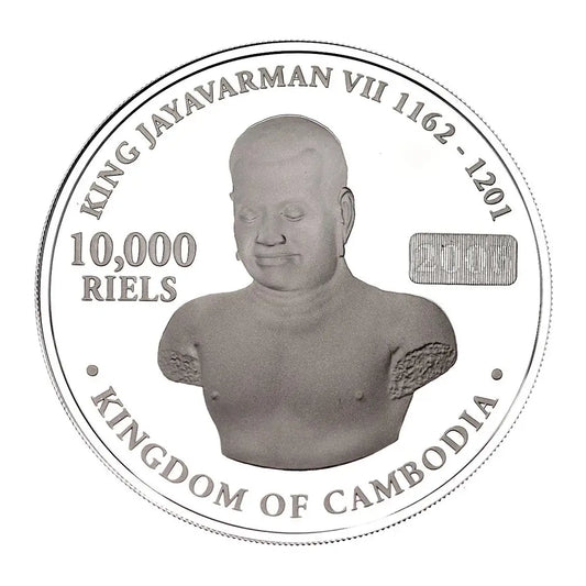 A circular silver coin featuring a relief bust of King Jayavarman VII of Cambodia, with the text 'KING JAYAVARMAN VII 1162 - 1201', '10,000 RIELS', and 'KINGDOM OF CAMBODIA' on a plain white background.