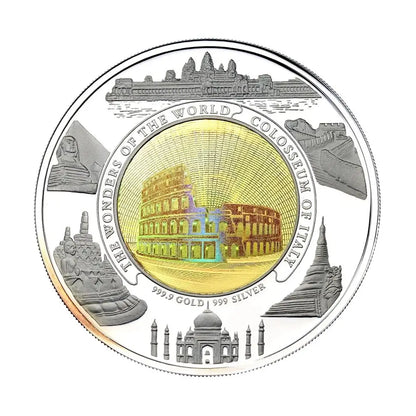 A round commemorative coin featuring the Seven Wonders of the World, with a gold-toned central colosseum design and silver-toned surrounding landmarks including the Sphinx, Great Wall, Taj Mahal, and St. Benedict's Monastery.