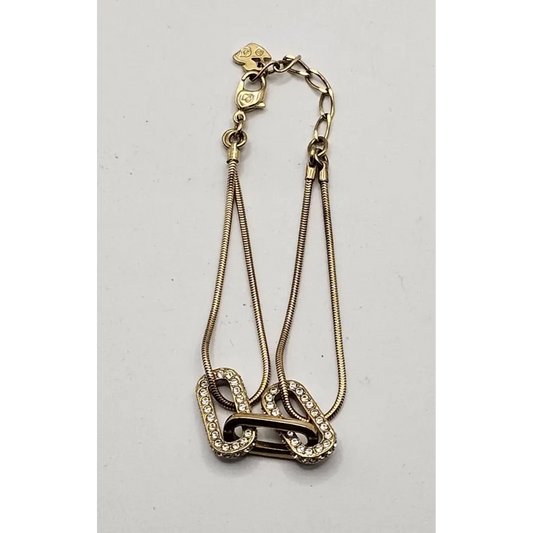 Gold chain necklace with a decorative clasp
