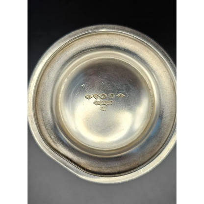 Close-up of a silver bowl with engraved details
