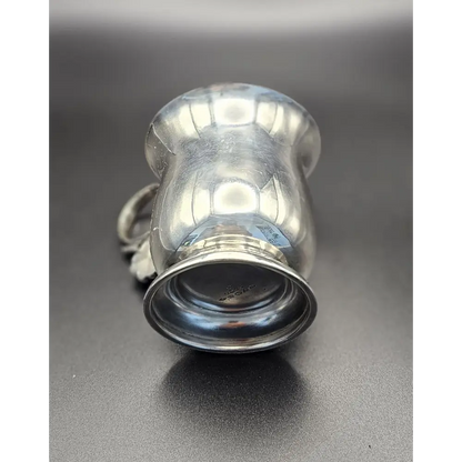 Silver cup on a gray background