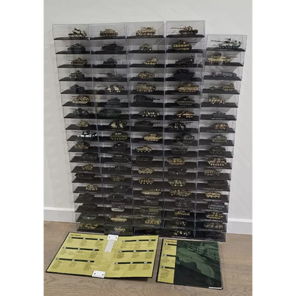 Collection of model tanks in clear display cases on a wooden floor with brochures.