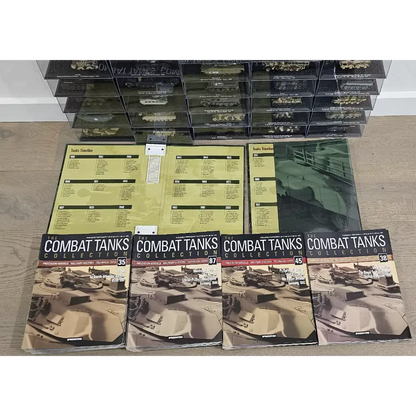 Collection of 'Combat Tanks' books and display cases on a wooden floor.
