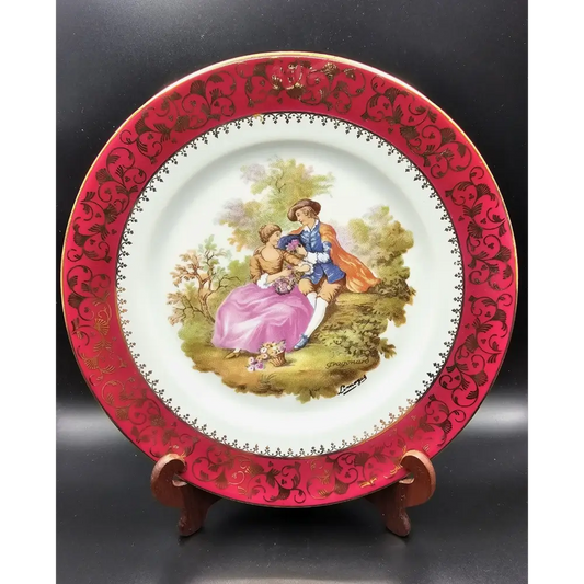Decorative plate with a romantic scene and red decorative border