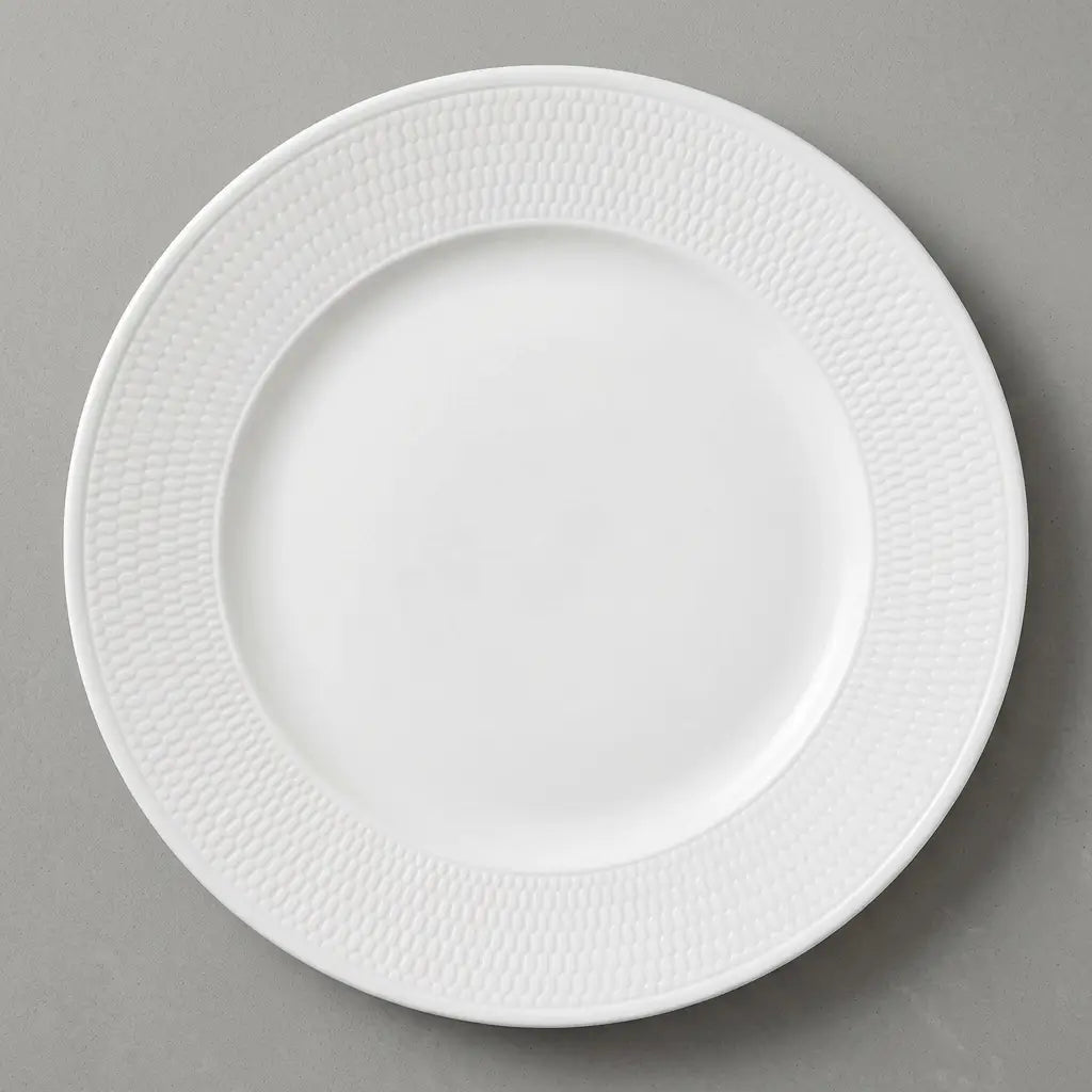 High-quality product photo of a 28.2 cm Wedgwood Gio dinner plate featuring a white fine bone china coupe design with a subtle intaglio textured rim.