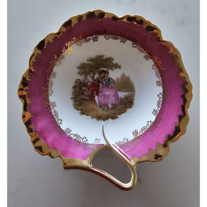 Vintage teacup with pink rim and gold handle