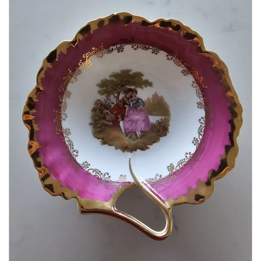 Vintage teacup with pink rim and gold handle