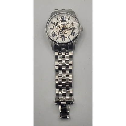 Silver wristwatch with a detailed face on a gray background