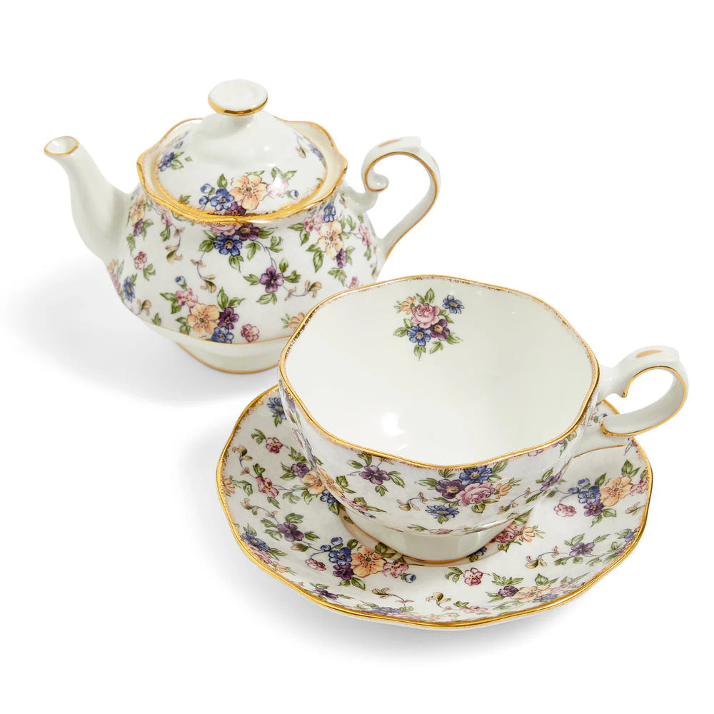 Tea set with floral design on a white background