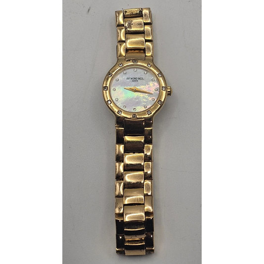 Gold wristwatch with a decorative face