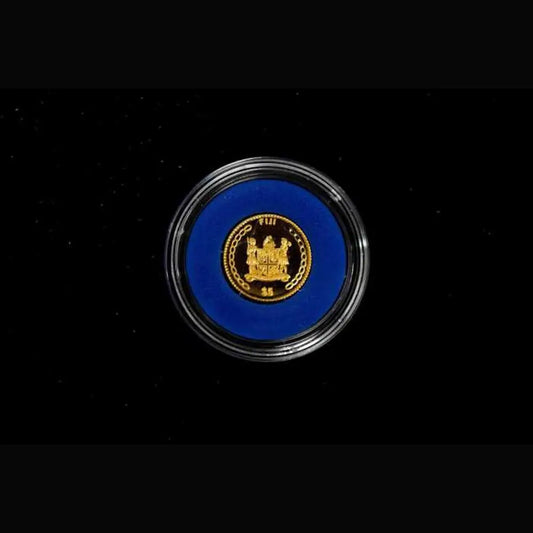 A round collectible coin or medallion featuring the gold seal of the Republic of the Congo, set against a vibrant blue background and enclosed in a clear protective capsule, shown on a black background from our World & Vintage Coins, Gold Proof Sets & Commemorative Medals collection 